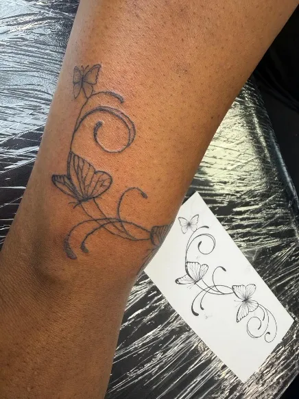 Butterfly tattoo with matching stencil on the arm